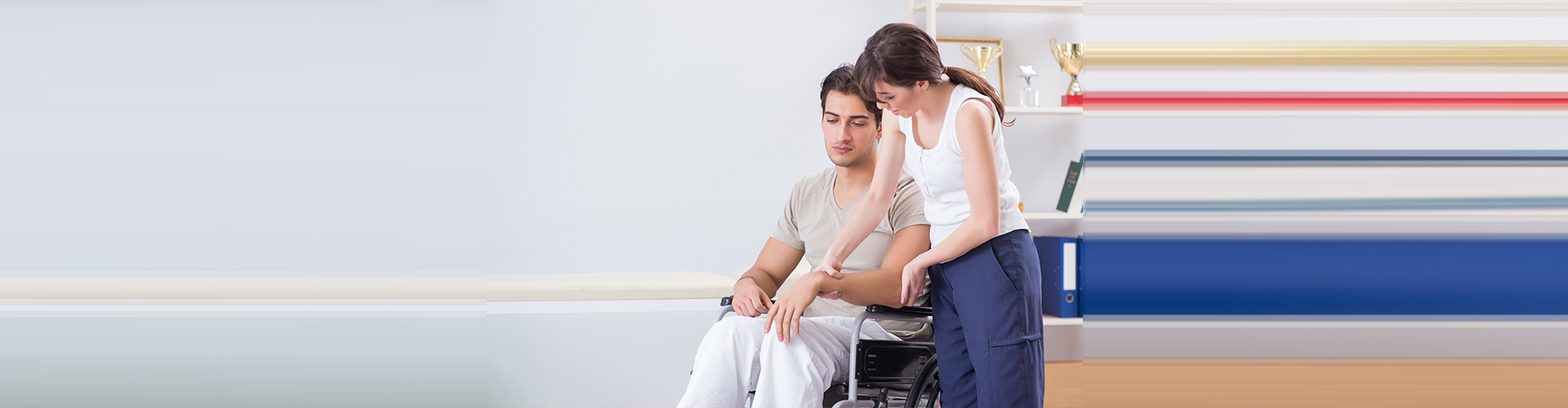 lady helping man in wheelchair